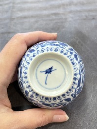 A set of six Chinese blue and white cups and saucers with floral design, Kangxi