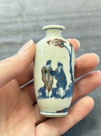 A Chinese peachbloom-crackle-glazed 'meiping' snuff bottle and a figural blue, white and copper-red snuff bottle, Yongzheng mark, 19th C.