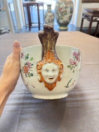 A Chinese famille rose 'mascarons' tureen and cover on stand with floral design, Qianlong
