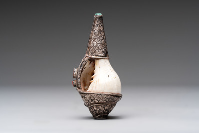 Two Tibetan brass and silver-mounted conch shell trumpets or 'Dung dkar', 19th C.