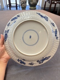 Six Chinese blue and white 'peony scroll' plates, Kangxi