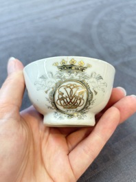 Four Chinese grisaille and gilt-decorated monogrammed cups and saucers, Qianlong, dated 1778