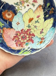 A pair of Chinese famille rose 'tobacco leaf' plates and a saucer, Qianlong