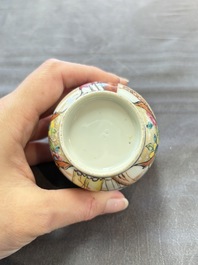 A Chinese Canton famille rose gilt-decorated covered cup and saucer, Qianlong