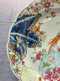 A pair of Chinese famille rose 'tobacco leaf' plates and a saucer, Qianlong