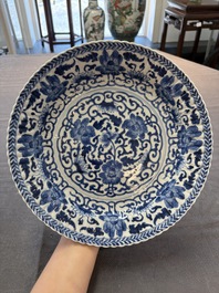 Six Chinese blue and white 'peony scroll' plates, Kangxi