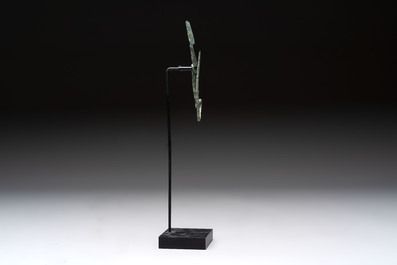 A large bronze Etruscan bow-shaped fibula and a Hungarian fibula with spring clasp, 12/7th C. B.C.