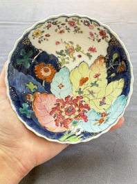 A pair of Chinese famille rose 'tobacco leaf' plates and a saucer, Qianlong