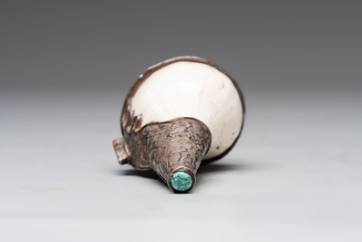 Two Tibetan brass and silver-mounted conch shell trumpets or 'Dung dkar', 19th C.