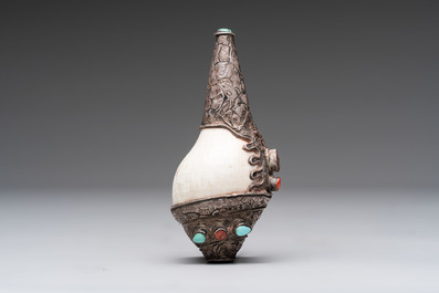 Two Tibetan brass and silver-mounted conch shell trumpets or 'Dung dkar', 19th C.