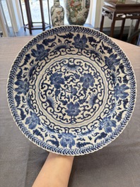 Six Chinese blue and white 'peony scroll' plates, Kangxi