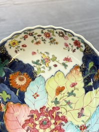 A pair of Chinese famille rose 'tobacco leaf' plates and a saucer, Qianlong