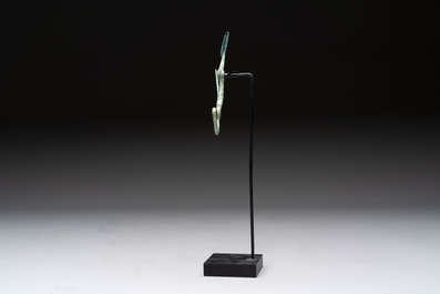 A large bronze Etruscan bow-shaped fibula and a Hungarian fibula with spring clasp, 12/7th C. B.C.