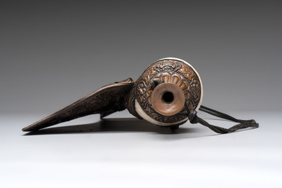 Two Tibetan brass and silver-mounted conch shell trumpets or 'Dung dkar', 19th C.