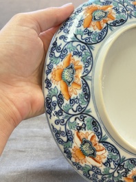 A Chinese doucai plate with floral scroll design, Tongzhi mark, 19/20th C.