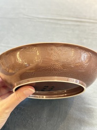 A Chinese copper-red-glazed incised 'dragon' plate, Guangxu mark and possibly of the period