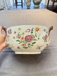 A Chinese famille rose 'mascarons' tureen and cover on stand with floral design, Qianlong