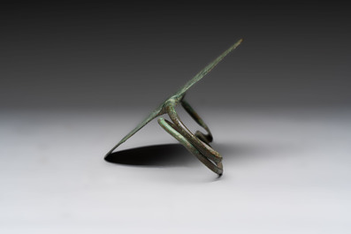 A large bronze Etruscan bow-shaped fibula and a Hungarian fibula with spring clasp, 12/7th C. B.C.