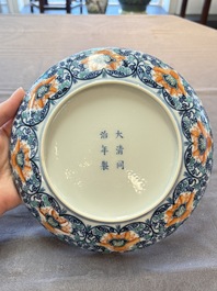A Chinese doucai plate with floral scroll design, Tongzhi mark, 19/20th C.