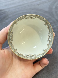 Four Chinese grisaille and gilt-decorated monogrammed cups and saucers, Qianlong, dated 1778