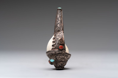 Two Tibetan brass and silver-mounted conch shell trumpets or 'Dung dkar', 19th C.