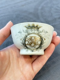 Four Chinese grisaille and gilt-decorated monogrammed cups and saucers, Qianlong, dated 1778