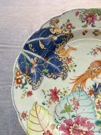 A pair of Chinese famille rose 'tobacco leaf' plates and a saucer, Qianlong