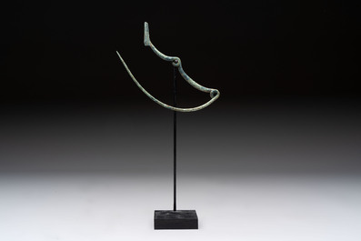 A large bronze Etruscan bow-shaped fibula and a Hungarian fibula with spring clasp, 12/7th C. B.C.