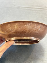 A Chinese copper-red-glazed incised 'dragon' plate, Guangxu mark and possibly of the period