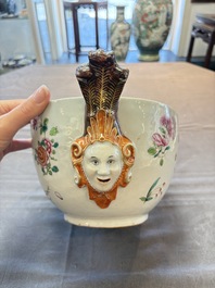 A Chinese famille rose 'mascarons' tureen and cover on stand with floral design, Qianlong