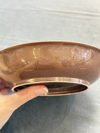 A Chinese copper-red-glazed incised 'dragon' plate, Guangxu mark and possibly of the period
