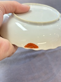 A pair of Chinese famille rose 'tobacco leaf' plates and a saucer, Qianlong