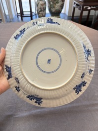 Six Chinese blue and white 'peony scroll' plates, Kangxi