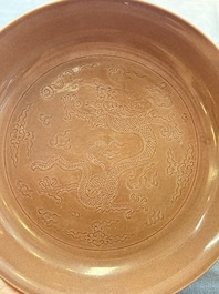 A Chinese copper-red-glazed incised 'dragon' plate, Guangxu mark and possibly of the period