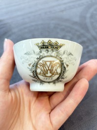 Four Chinese grisaille and gilt-decorated monogrammed cups and saucers, Qianlong, dated 1778
