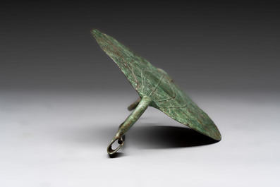 A large bronze Etruscan bow-shaped fibula and a Hungarian fibula with spring clasp, 12/7th C. B.C.