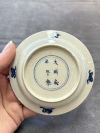 Eight Chinese blue, white and iron-red cups and twelve saucers, Kangxi/Yongzheng