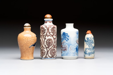 Two Chinese blue, white and copper-red snuff bottles and two blue and white snuff bottles, 19th C.