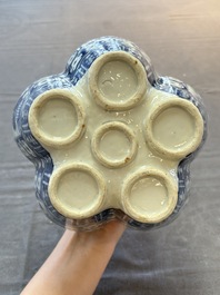 A Chinese blue and white tulip vase with floral design, 19th C.