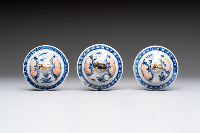 Three Chinese famille rose 'mandarin subject' vases and covers, Qianlong