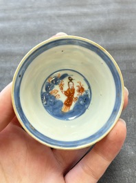Eight Chinese blue, white and iron-red cups and twelve saucers, Kangxi/Yongzheng