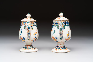 A pair of polychrome Dutch Delft mustard jars and covers, 18th C.