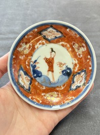 Eight Chinese blue, white and iron-red cups and twelve saucers, Kangxi/Yongzheng