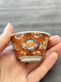 Eight Chinese blue, white and iron-red cups and twelve saucers, Kangxi/Yongzheng