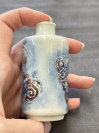 Two Chinese blue, white and copper-red snuff bottles and two blue and white snuff bottles, 19th C.