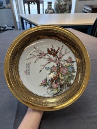 A Chinese famille rose gilt-decorated dish with birds among blossoming branches, Yongzheng mark, 20th C.