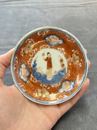 Eight Chinese blue, white and iron-red cups and twelve saucers, Kangxi/Yongzheng