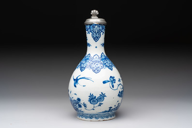A fine blue and white Dutch Delft jug with pewter cover, early 18th C.