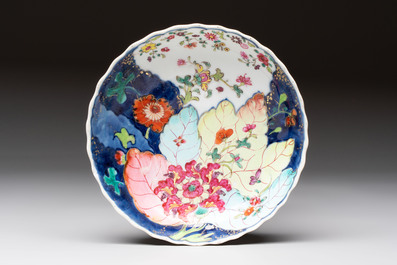 A pair of Chinese famille rose 'tobacco leaf' plates and a saucer, Qianlong
