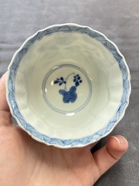 Eight Chinese blue, white and iron-red cups and twelve saucers, Kangxi/Yongzheng